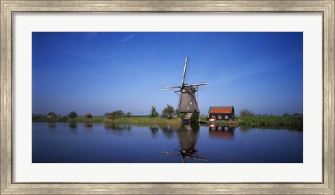 Framed Reflection of a traditional windmill in a lake, Netherlands Print