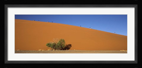 Framed Tourists climbing up a sand dune, Dune 45, Sossusvlei, Namib Desert, Namibia Print