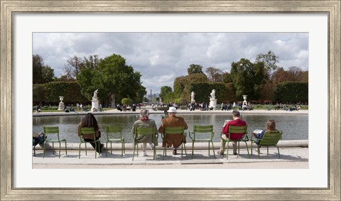 Framed Tourists sitting in chairs, Jardin de Tuileries, Paris, Ile-de-France, France Print