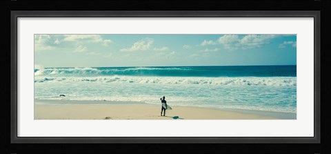 Framed Surfer standing on the beach, North Shore, Oahu, Hawaii Print