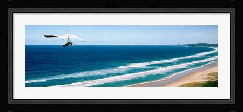 Framed Hang glider over the sea Print