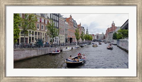 Framed Tourboats in a canal, Amsterdam, Netherlands Print