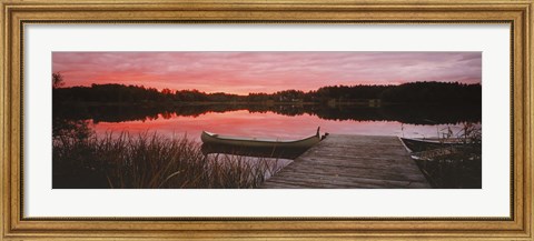 Framed Canoe tied to dock on a small lake at sunset, Sweden Print