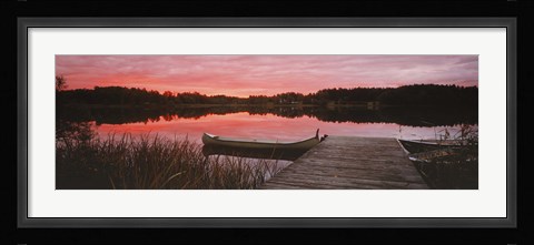 Framed Canoe tied to dock on a small lake at sunset, Sweden Print