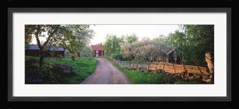 Framed Dirt road leading to farmhouses, Stensjoby, Smaland, Sweden Print