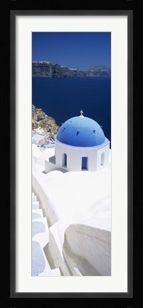 Framed High angle view of a church with blue dome, Oia, Santorini, Cyclades Islands, Greece Print