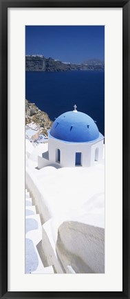 Framed High angle view of a church with blue dome, Oia, Santorini, Cyclades Islands, Greece Print