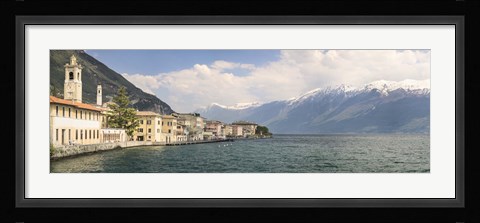 Framed Buildings at the waterfront with snowcapped mountain in the background, Gargnano, Monte Baldo, Lake Garda, Lombardy, Italy Print