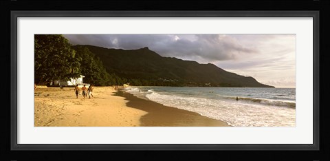 Framed People walking along the Beau Vallon beach, Mahe Island, Seychelles Print
