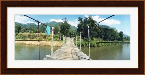 Framed Old wooden bridge across the river, Chiang Mai Province, Thailand Print