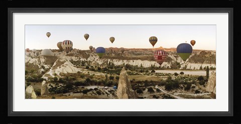 Framed Mulit colored hot air balloons at sunrise over Cappadocia, Central Anatolia Region, Turkey Print