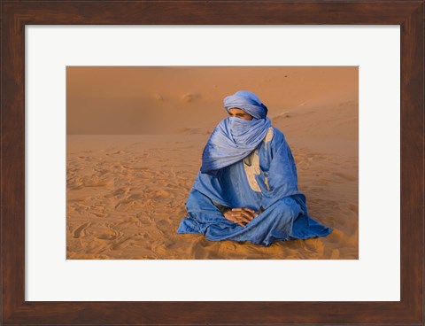 Framed Veiled Tuareg man sitting cross-legged on the sand, Erg Chebbi, Morocco Print