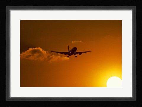 Framed Silhouette of airliner in golden sunset Print