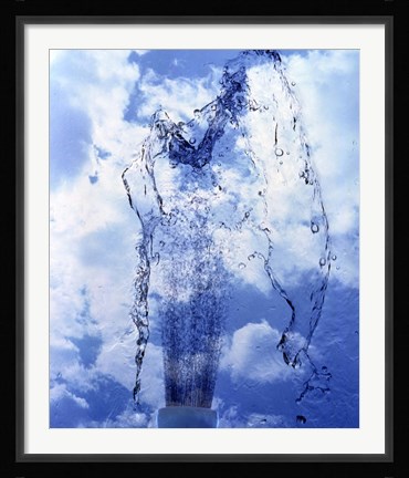 Framed Slow motion geyser of water rising through blue sky and clouds Print