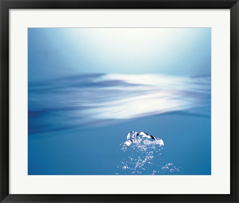 Framed Water bubbles rising to surface of water toward bright light Print