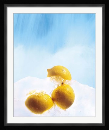 Framed Three lemons frozen in ice below ice blue sky Print