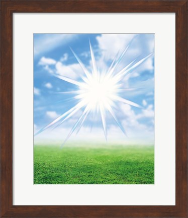 Framed Bright star like light floating in blue sky and clouds over green land Print