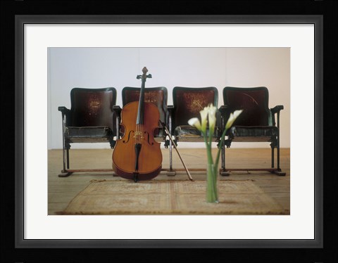 Framed Cello leaning on attached chairs Print