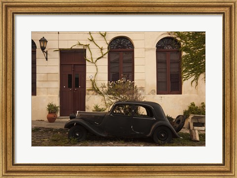 Framed Vintage car parked in front of a house, Calle De Portugal, Colonia Del Sacramento, Uruguay Print