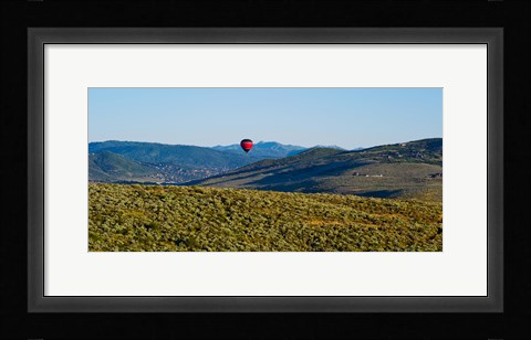 Framed Hot air balloon flying in a valley, Park City, Utah, USA Print