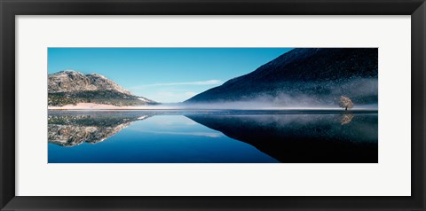 Framed Reflection of a mountain with snowy trees on a lake in winter afternoon, Cote d&#39;Azur, France Print