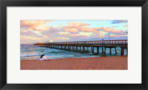 Framed Couple sitting on the beach at sunset, Fort Lauderdale, Florida, USA Print