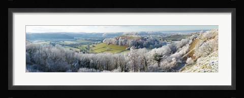 Framed Snow covered trees in a valley from Uley Bury, Downham Hill, Gloucestershire, England Print
