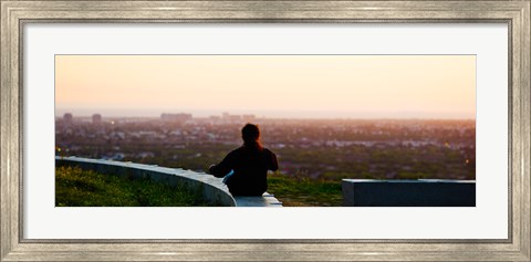 Framed Man sting on the ledge in Baldwin Hills Scenic Overlook Park, Culver City, Los Angeles County, California, USA Print