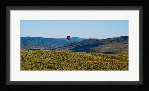 Framed Hot air balloon flying in a valley, Park City, Utah, USA Print