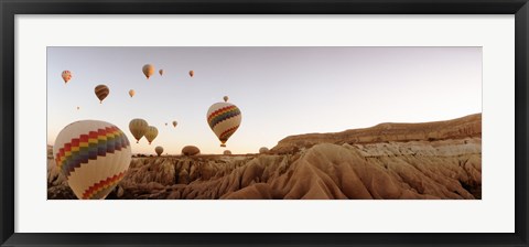 Framed Hot air balloons crossing a plateau, Cappadocia, Central Anatolia Region, Turkey Print