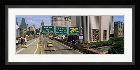 Framed Suspension bridge with buildings in a city, Brooklyn Bridge, New York City, New York State, USA Print