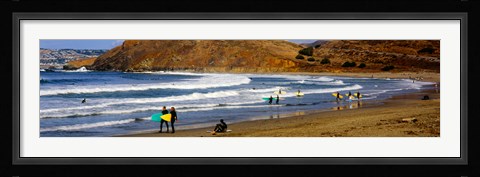 Framed Surfers on the beach, California, USA Print
