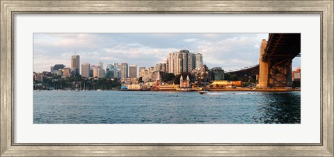 Framed Skyscrapers at the waterfront, McMahons Point, Sydney Harbor Bridge, Sydney Harbor, Sydney, New South Wales, Australia 2012 Print