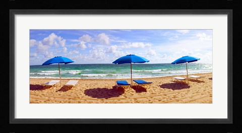 Framed Lounge chairs and beach umbrellas on the beach, Fort Lauderdale Beach, Florida, USA Print