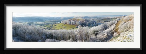 Framed Snow covered trees in a valley from Uley Bury, Downham Hill, Gloucestershire, England Print