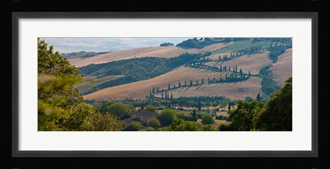 Framed High angle view of winding road in valley, Tuscany, Italy Print