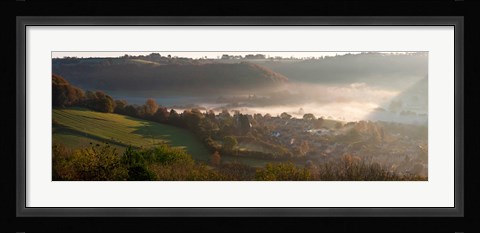 Framed Misty morning valley with village, Uley, Gloucestershire, England Print
