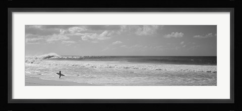 Framed Surfer standing on the beach in black and white, Oahu, Hawaii Print