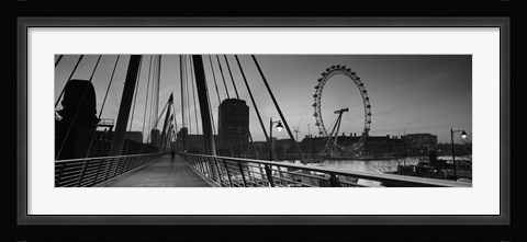 Framed Bridge across a river with a ferris wheel, Golden Jubilee Bridge, Thames River, Millennium Wheel, London, England Print