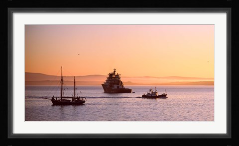 Framed Tugboat with a trawler and a tall ship in the Baie de Douarnenez at sunrise, Finistere, Brittany, France Print