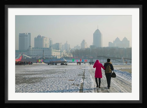 Framed Couple walking on a frozen river, Songhua River, Harbin, Heilungkiang Province, China Print
