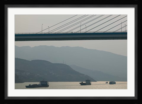 Framed Container ships passing a newly constructed bridge on the Yangtze River, Wanzhou, Chongqing Province, China Print