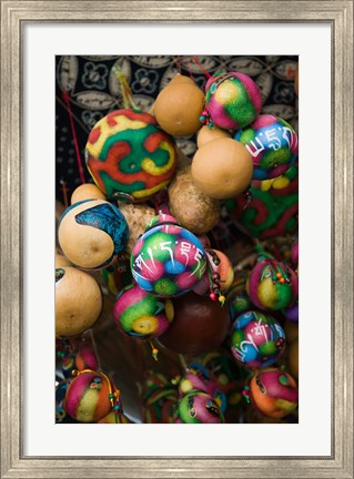 Framed Painted gourds for sale in a street market, Old Town, Lijiang, Yunnan Province, China Print