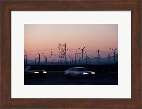 Framed Cars moving on road with wind turbines in background at dusk, Palm Springs, Riverside County, California, USA Print