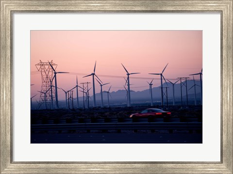 Framed Car moving on a road with wind turbines in background at dusk, Palm Springs, Riverside County, California, USA Print