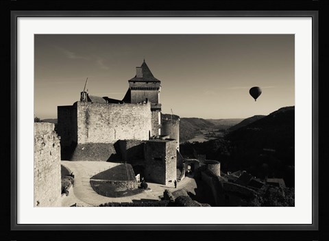 Framed Chateau de Castelnaud with hot air balloon flying over a valley, Castelnaud-la-Chapelle, Dordogne, Aquitaine, France Print