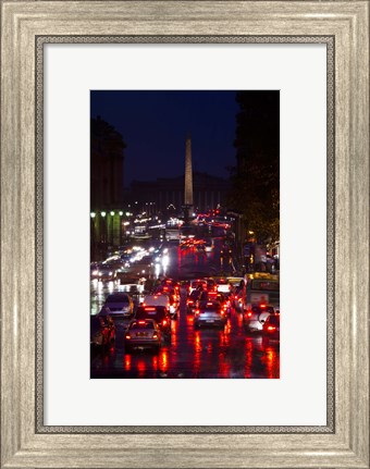 Framed Elevated view of traffic on the road at night viewed from Eglise Madeleine church, Rue Royale, Paris, Ile-de-France, France Print