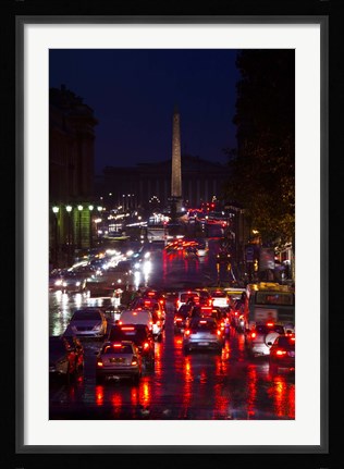 Framed Elevated view of traffic on the road at night viewed from Eglise Madeleine church, Rue Royale, Paris, Ile-de-France, France Print