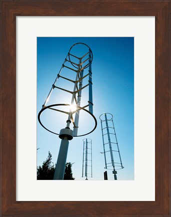 Framed Low angle view of vertical windmills Print