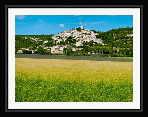 Framed Farm with a town in the background, Simiane-La-Rotonde, Alpes-de-Haute-Provence, Provence-Alpes-Cote d'Azur, France Print